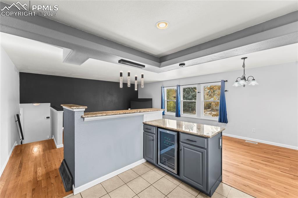 526 Griffith Way Colorado Springs, CO 80911 - Photo 10 of 46 a kitchen with a stove and a wooden floors
