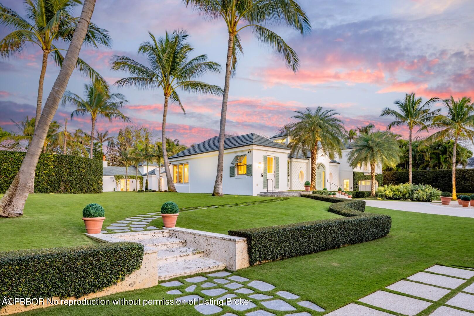 710 South County Road Palm Beach, FL 33480 - Photo 4 of 69 a front view of a house with a garden and trees