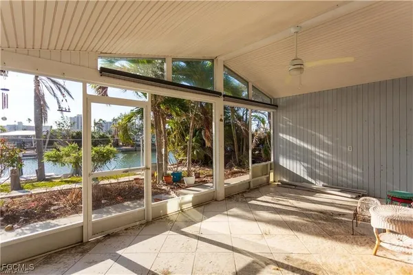 a view of a building with wooden floor and floor to ceiling window