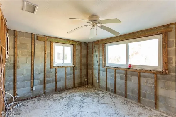 a view of a bathroom with a tub shower and a sink
