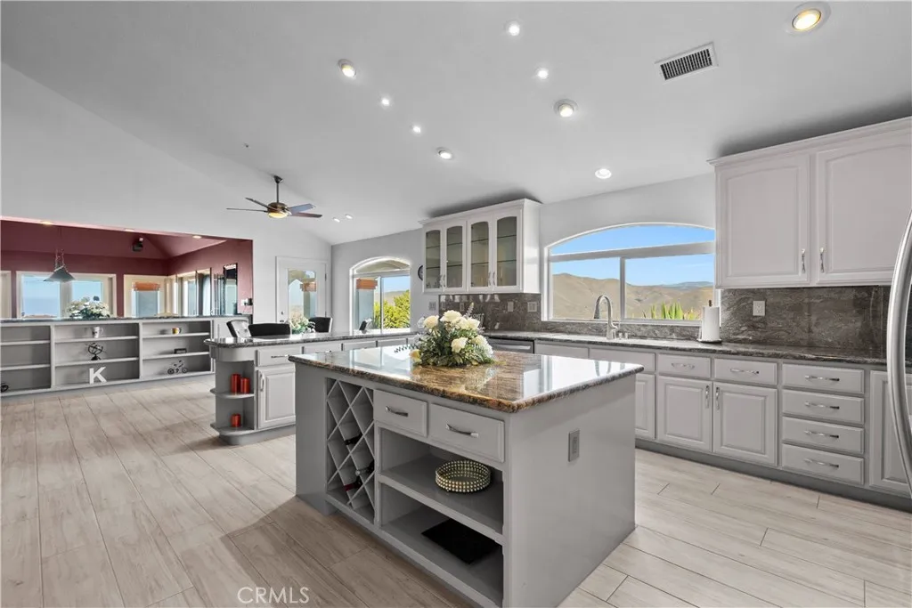 31800 Diamond View Lane Agua Dulce, CA 91390 - Photo 12 of 36 a kitchen with a stove cabinets and wooden floor