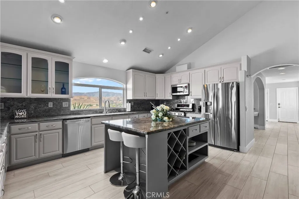 31800 Diamond View Lane Agua Dulce, CA 91390 - Photo 14 of 36 a kitchen with stainless steel appliances granite countertop a stove and a refrigerator