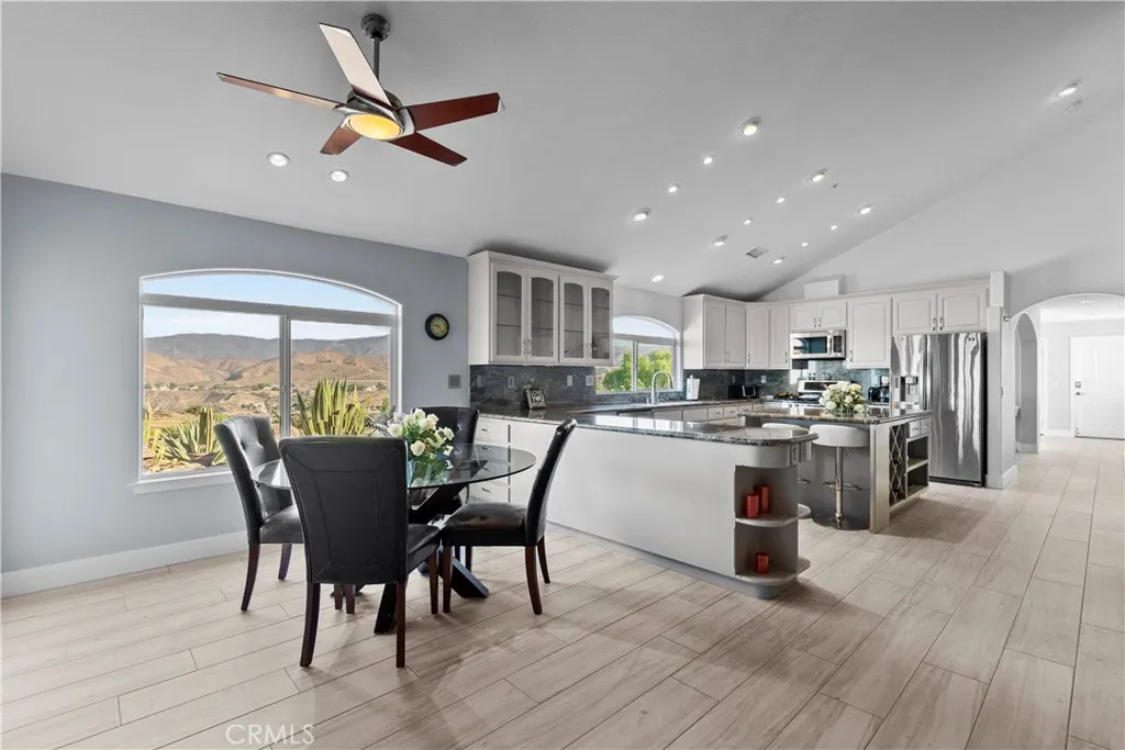 31800 Diamond View Lane Agua Dulce, CA 91390 - Photo 19 of 36 a kitchen with a table chairs refrigerator and microwave