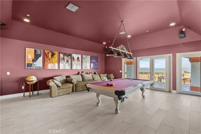 a living room with furniture a rug and a large window