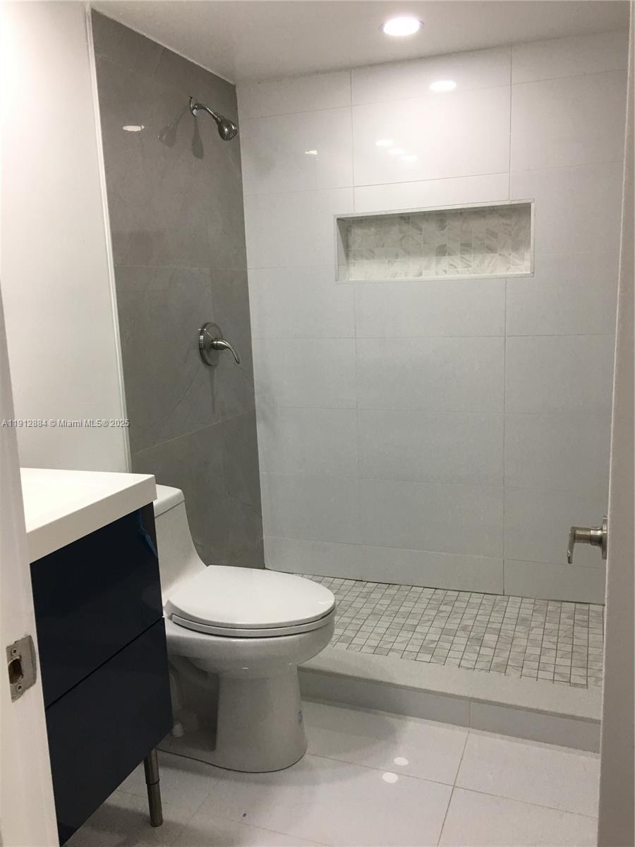 Boca del Mar Boca Raton, FL 33433 - Photo 4 of 6 a bathroom with a toilet and a shower