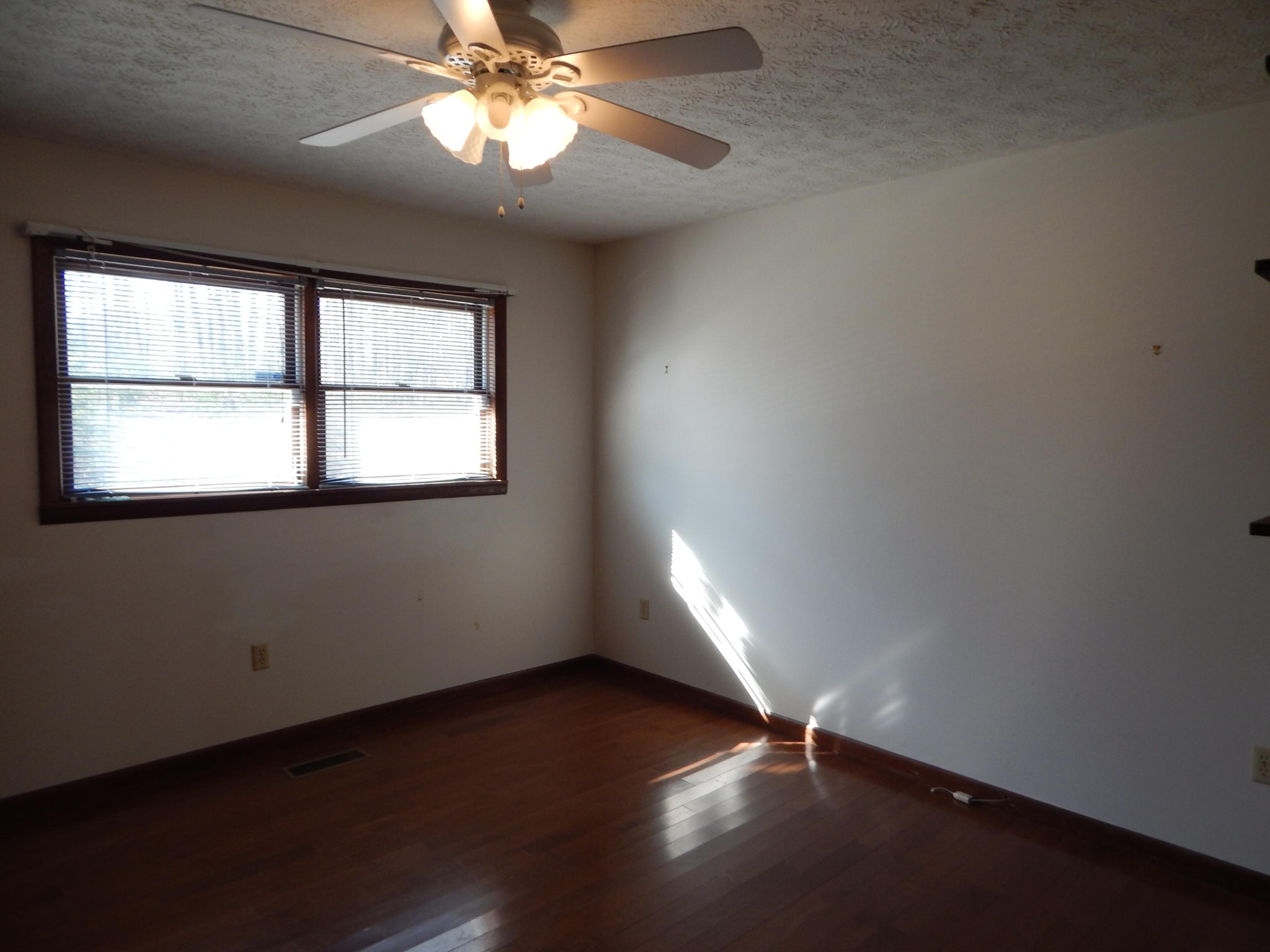 310 Houston Road Crossville, TN 38555 - Photo 24 of 40 an empty room with wooden floor and windows