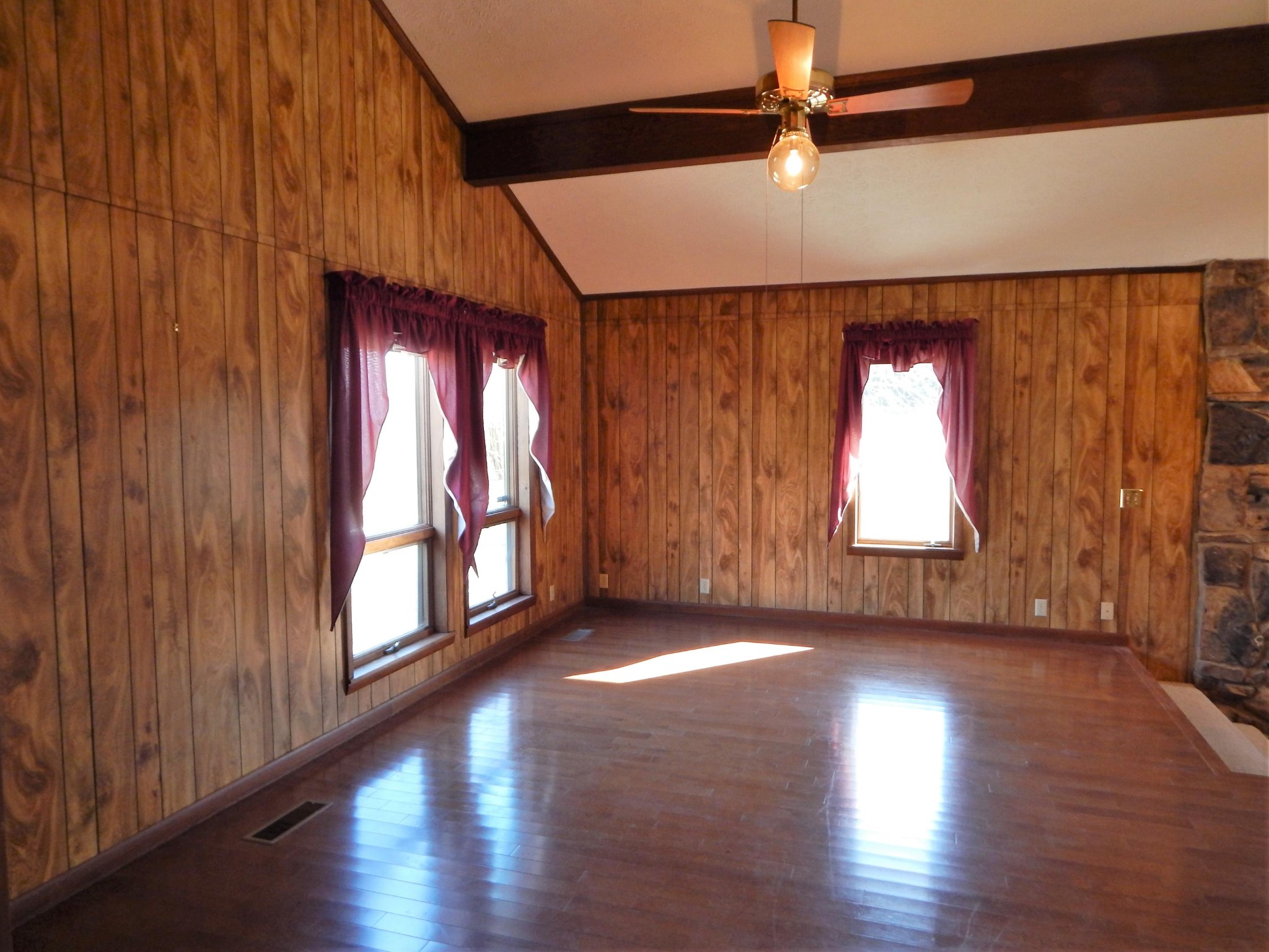 310 Houston Road Crossville, TN 38555 - Photo 10 of 40 an empty room with wooden floor and windows