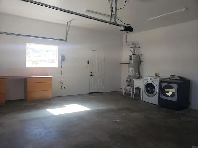 a view of a room with window washer and dryer