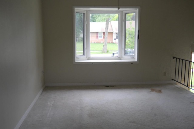 1290 Post Road Aurora, IL 60506 - Photo 2 of 7 an empty room with a window