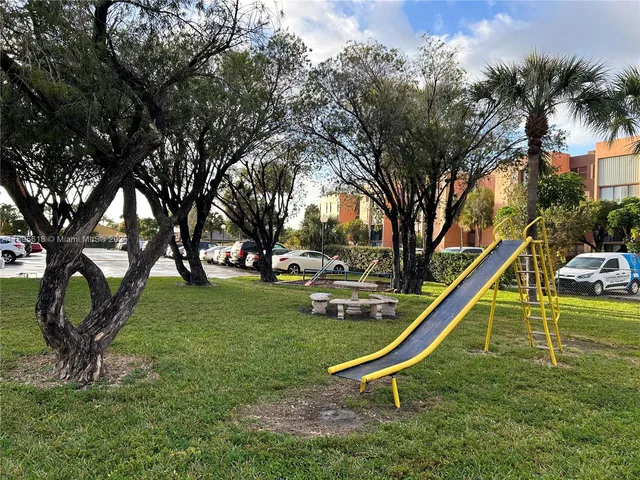 a view of a street with fence