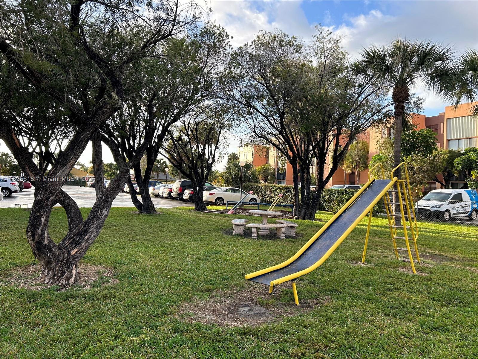 9411 Southwest 4th Street, Unit 202 Miami, FL 33174 - Photo 11 of 20 a garden with trees
