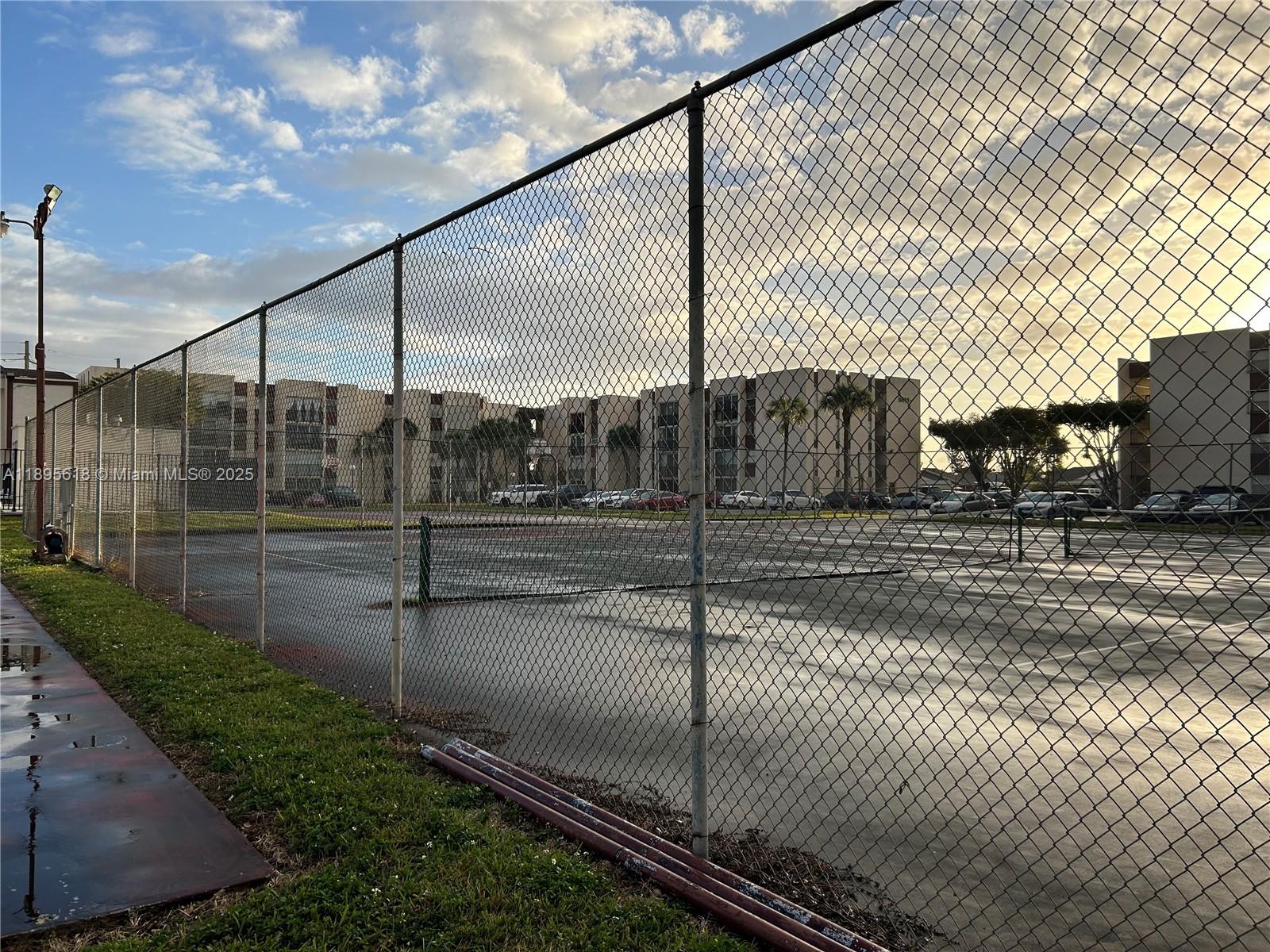 9411 Southwest 4th Street, Unit 202 Miami, FL 33174 - Photo 12 of 20 a view of a street with fence