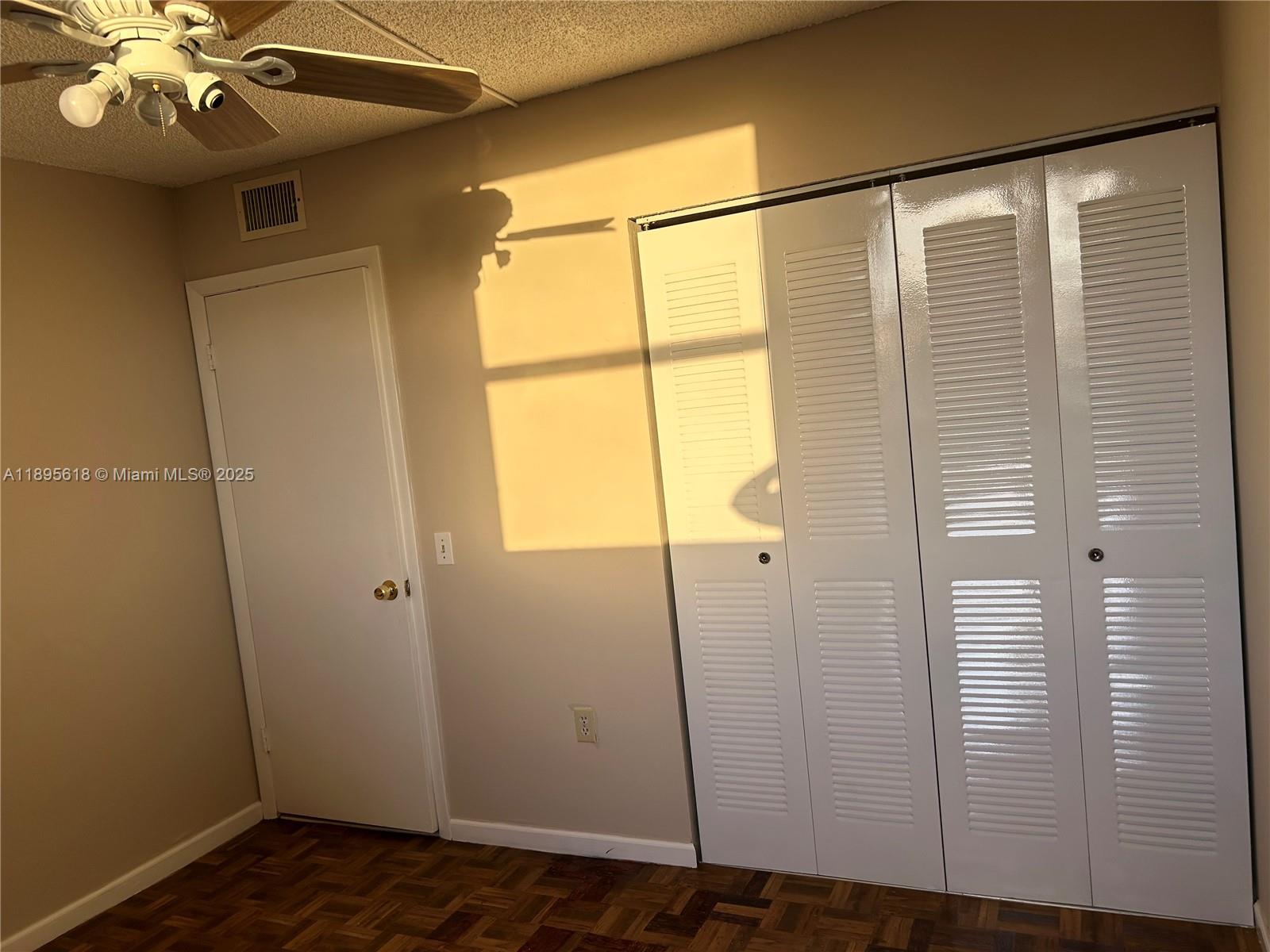 9411 Southwest 4th Street, Unit 202 Miami, FL 33174 - Photo 16 of 20 a view of empty room with wooden floor