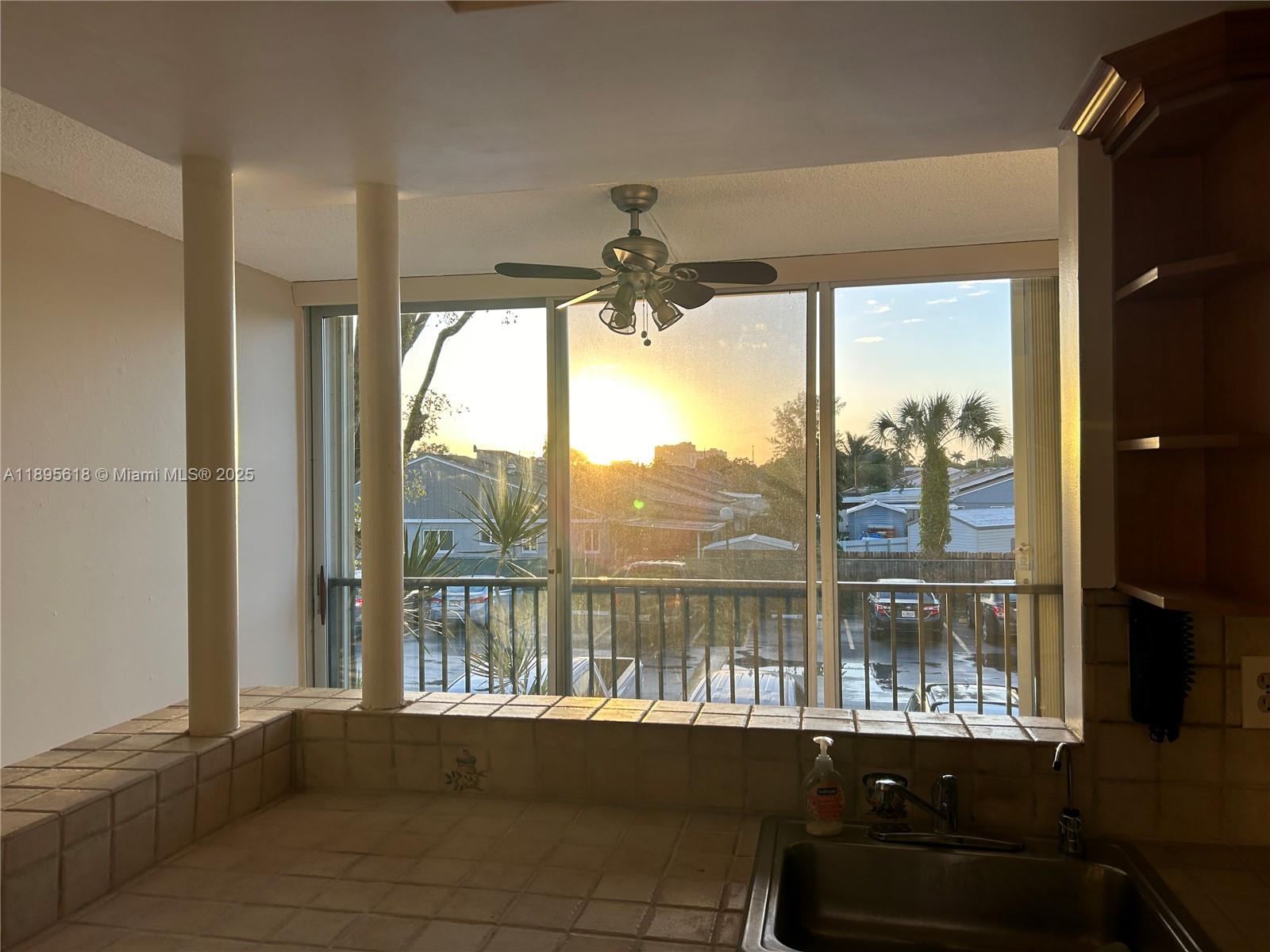 9411 Southwest 4th Street, Unit 202 Miami, FL 33174 - Photo 18 of 20 a view of a room with a floor to ceiling window and an outdoor view