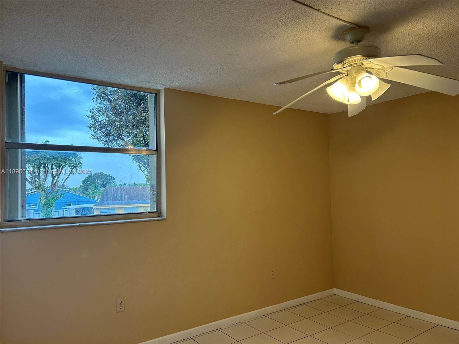 9411 Southwest 4th Street, Unit 202 Miami, FL 33174 - Photo 3 of 20 a view of a small space with racks on the wall