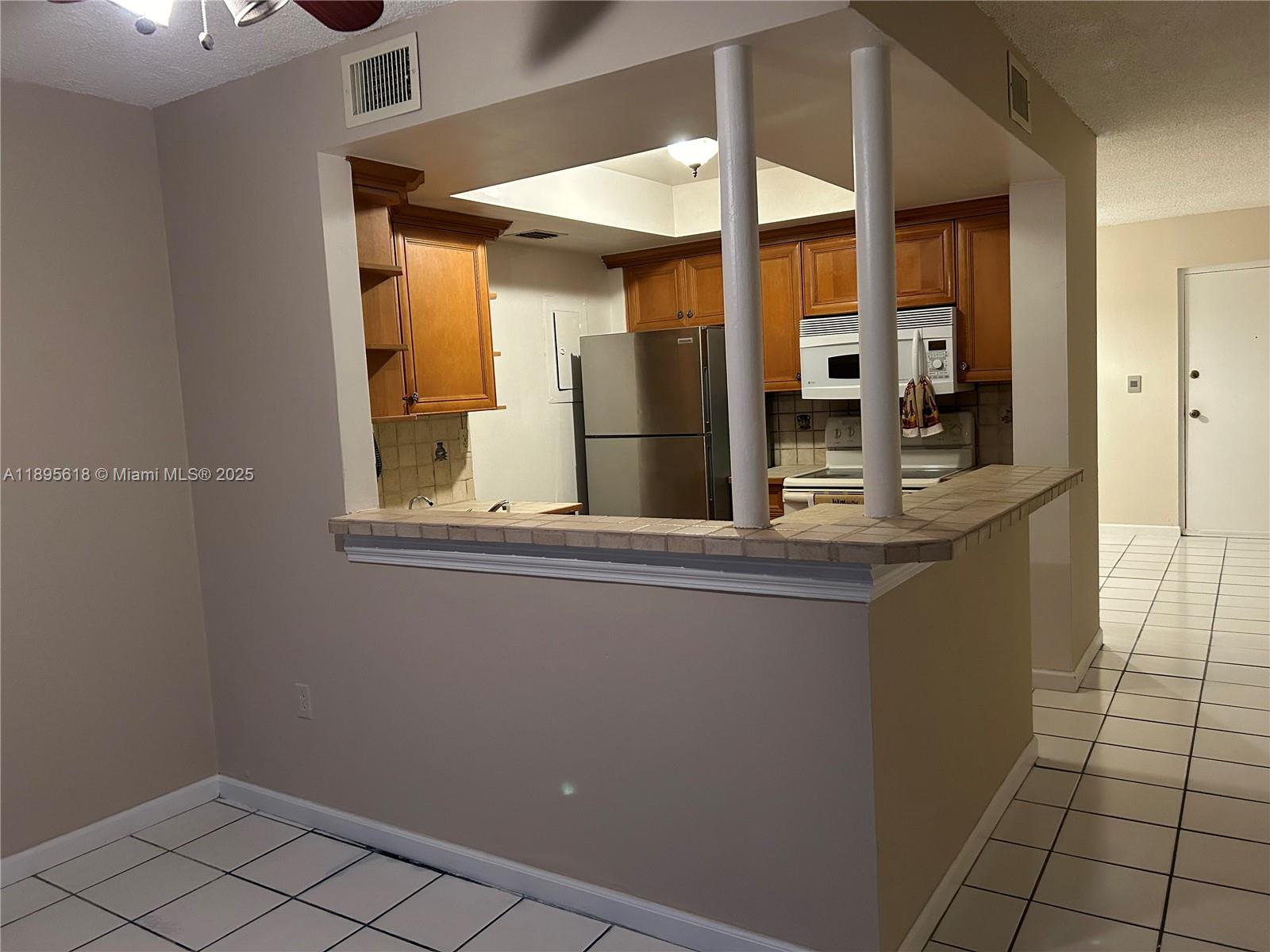 9411 Southwest 4th Street, Unit 202 Miami, FL 33174 - Photo 8 of 20 a bathroom with a sink and mirror