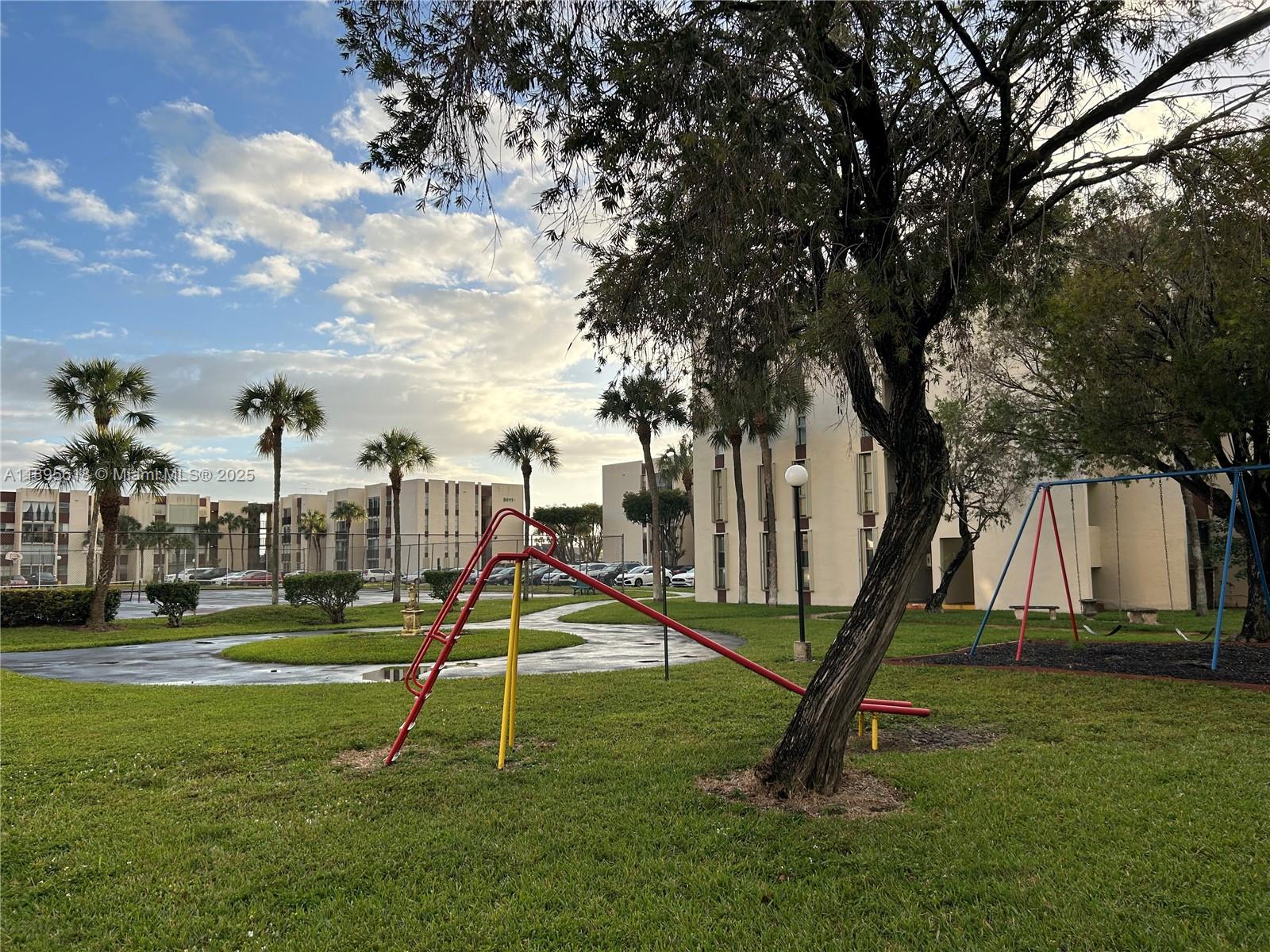 9411 Southwest 4th Street, Unit 202 Miami, FL 33174 - Photo 10 of 20 a view of a park with a slide