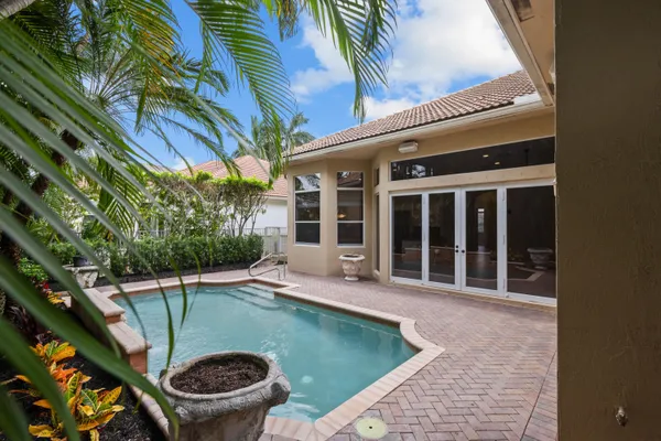 a house with swimming pool in front of it