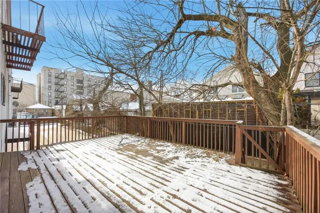 a view of a wooden house with a large window