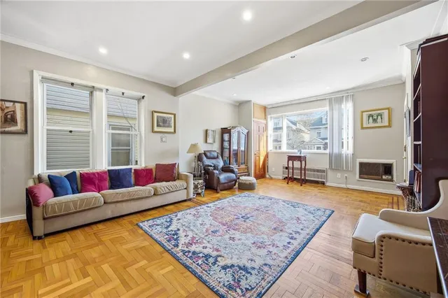a living room with furniture and a rug
