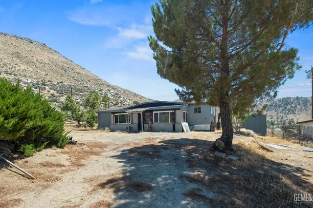 a view of a backyard of a house