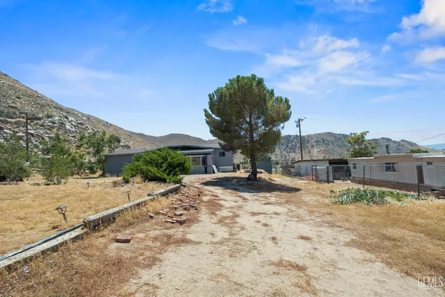 a view of a house with a snow in the yard