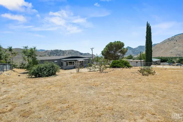 a view of a backyard of the house