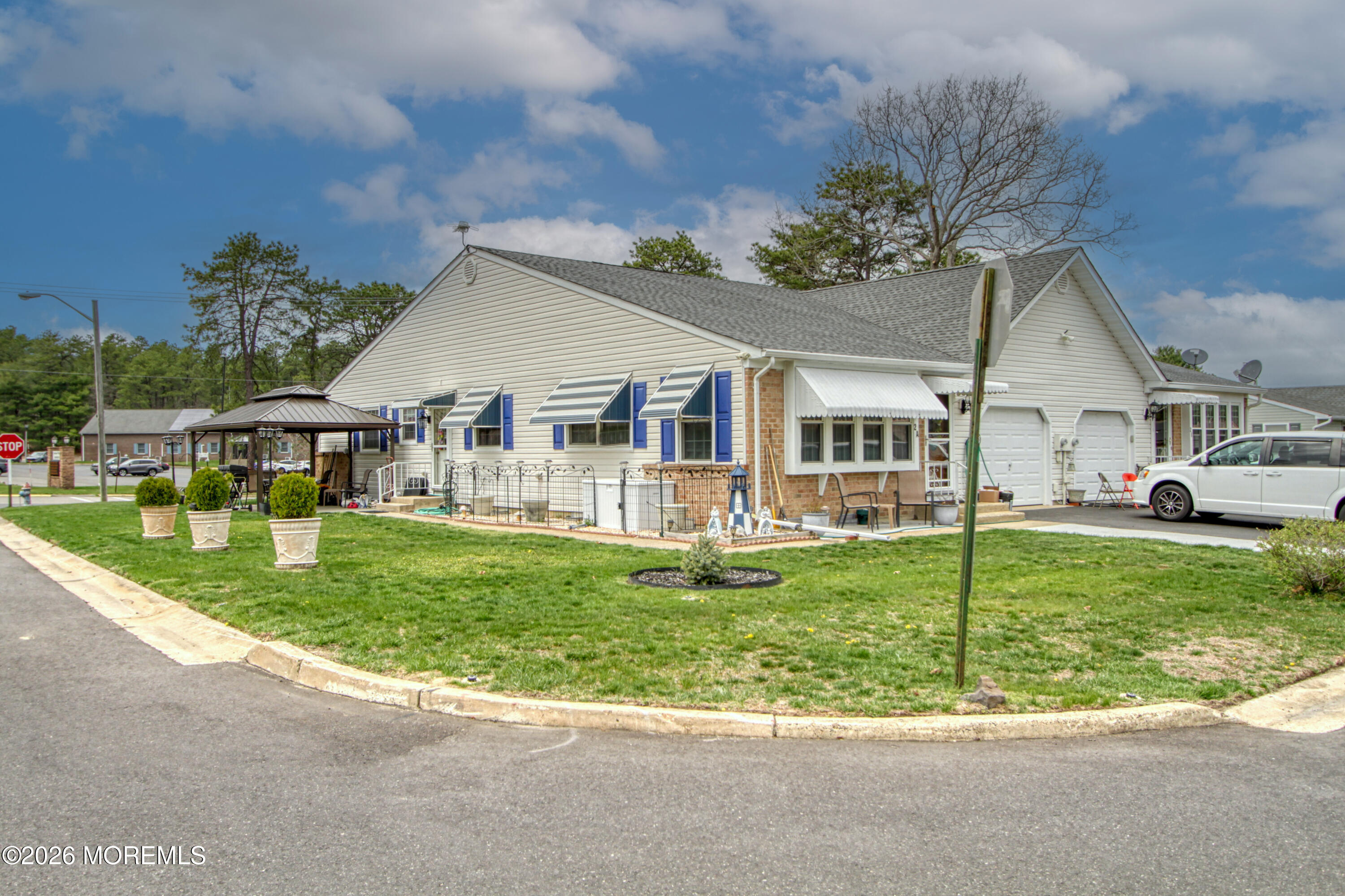 2B Amherst Road, Unit A Whiting, NJ 08759 - Photo 16 of 16 a view of a house with a backyard porch and sitting area