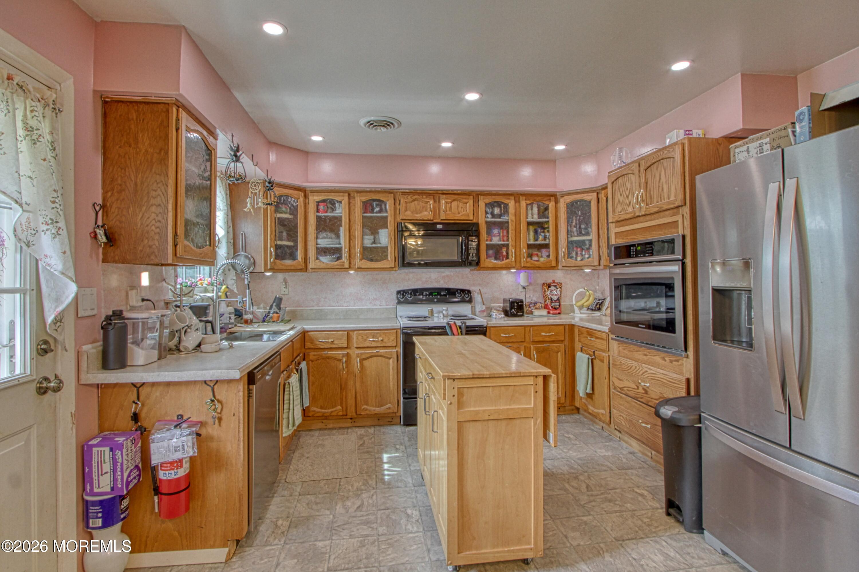 2B Amherst Road, Unit A Whiting, NJ 08759 - Photo 2 of 16 a kitchen with stainless steel appliances granite countertop a refrigerator and a sink