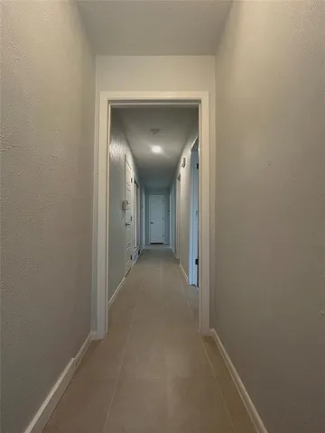a view of hallway with closet