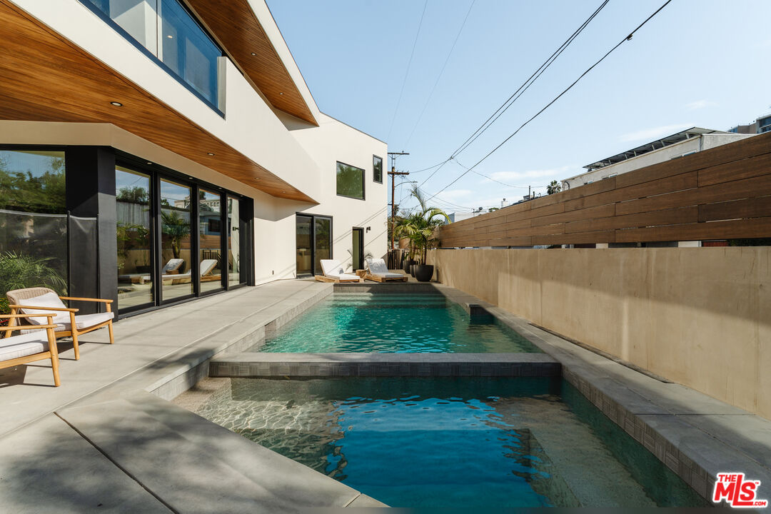 726 Howard Street Marina del Rey, CA 90292 - Photo 38 of 47 a view of a patio with table and chairs with wooden floor and fence