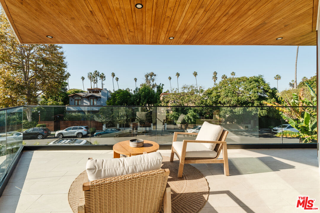 726 Howard Street Marina del Rey, CA 90292 - Photo 46 of 47 a roof deck with table and chairs under an umbrella