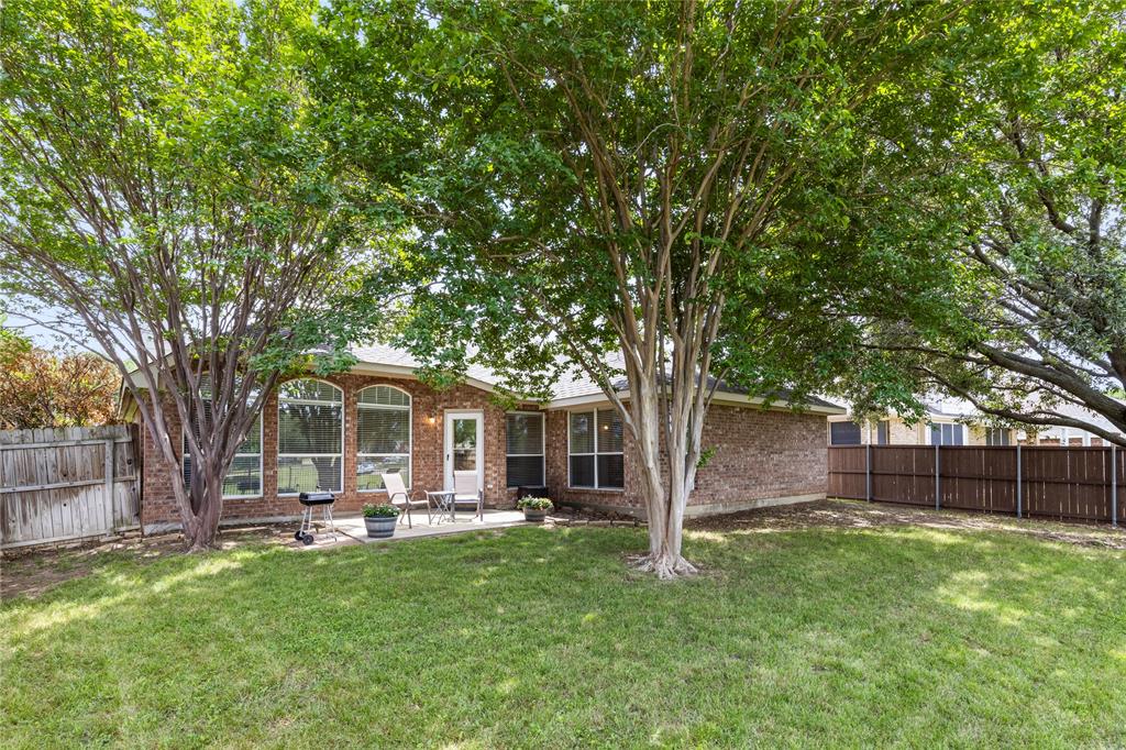 3724 Ranchman Boulevard Denton, TX 76210 - Photo 24 of 31 Shaded back yard overlooking green space.