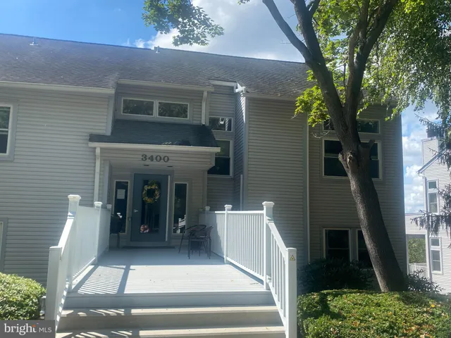 a view of a brick house with many windows
