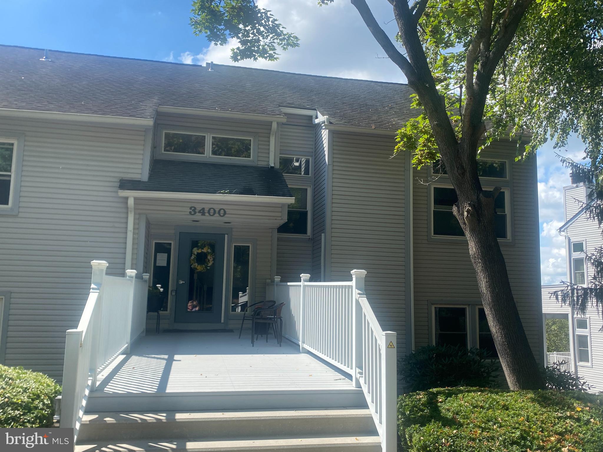 a view of a brick house with many windows