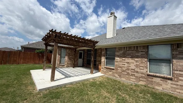 front view of a house with a garden