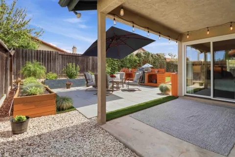a patio with table and chairs