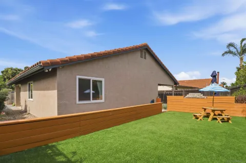 a backyard of a house with lots of green space