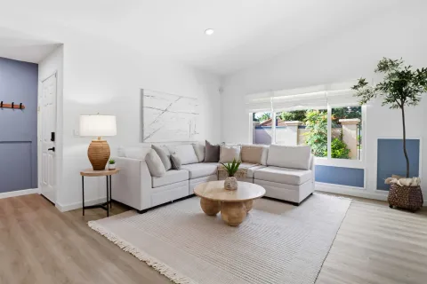 a living room with furniture and a large window