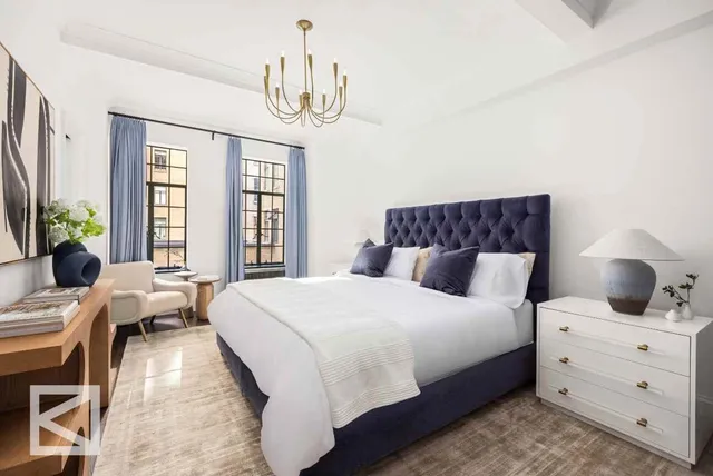 a bedroom with bed and a window