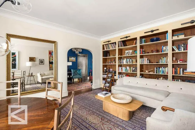 a living room with furniture and a rug