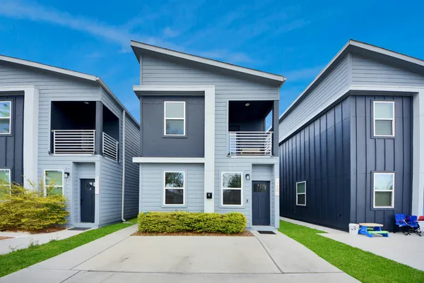 a view of kitchen with cabinets and wooden floor