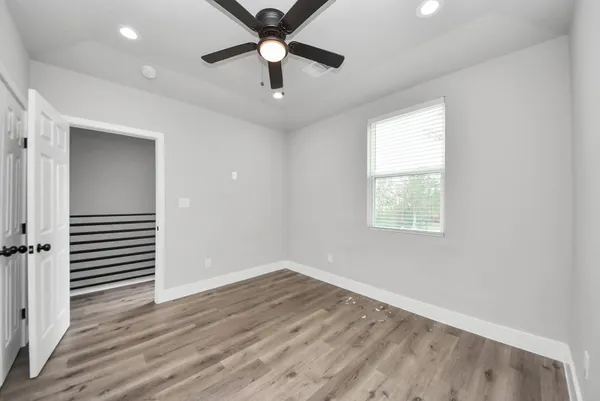 a view of a balcony with floor to ceiling windows and walls