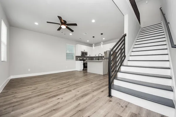 a kitchen with a sink and refrigerator