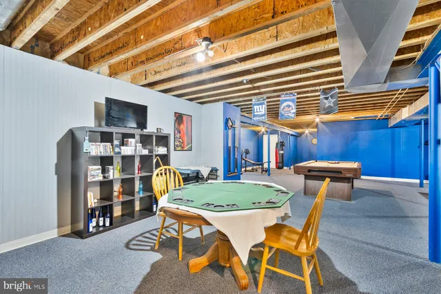 a dining room with a table and chairs