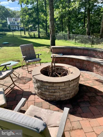 a view of a backyard with sitting area