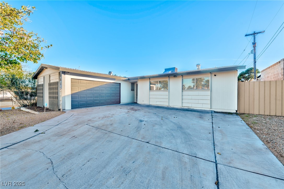 3017 Jamestown Way Las Vegas, NV 89102 - Photo 2 of 15 Ranch-style house with driveway and an attached garage