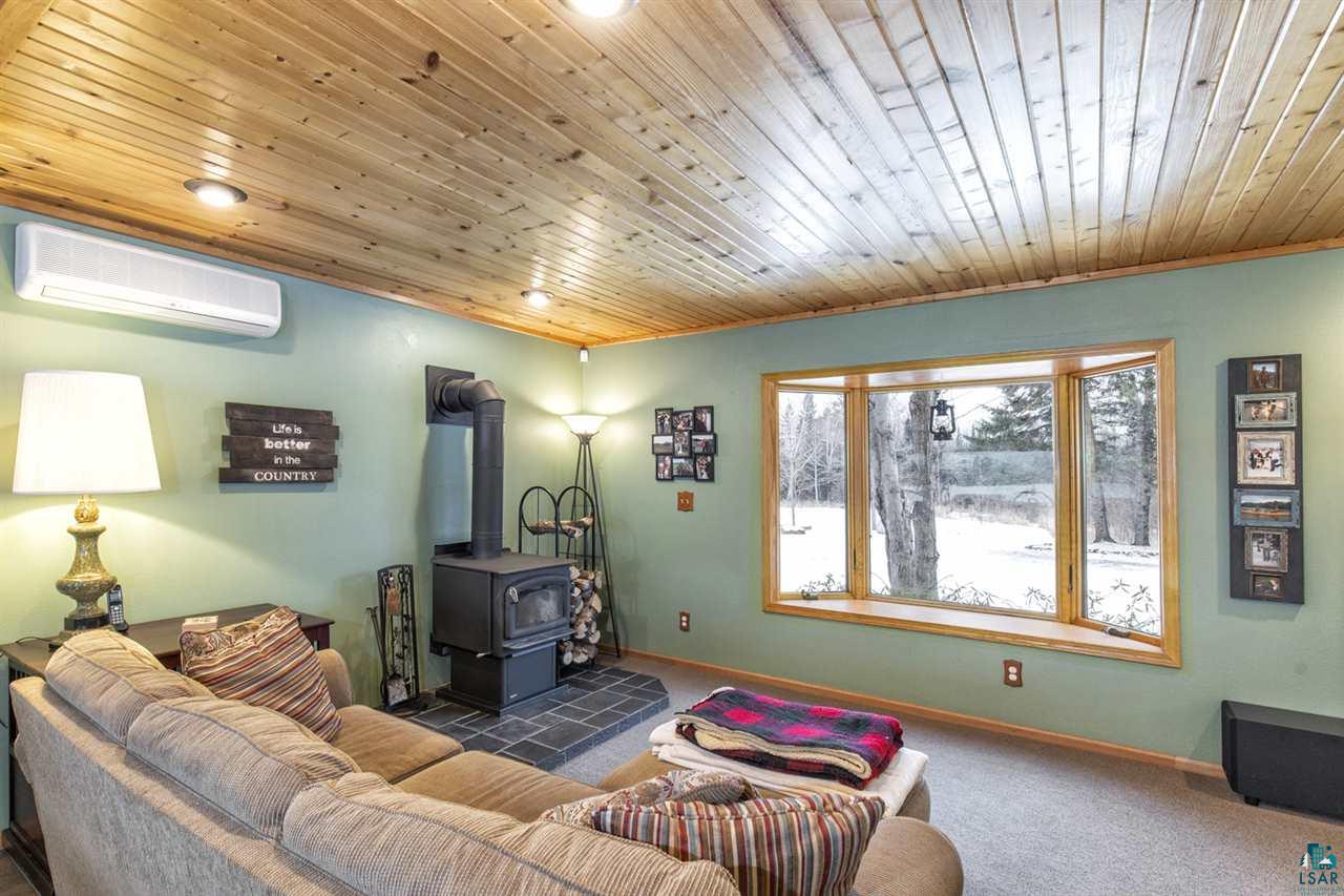 6404 Arnold Road Duluth, MN 55803 - Photo 23 of 38 Main Floor Family Room w/woodstove