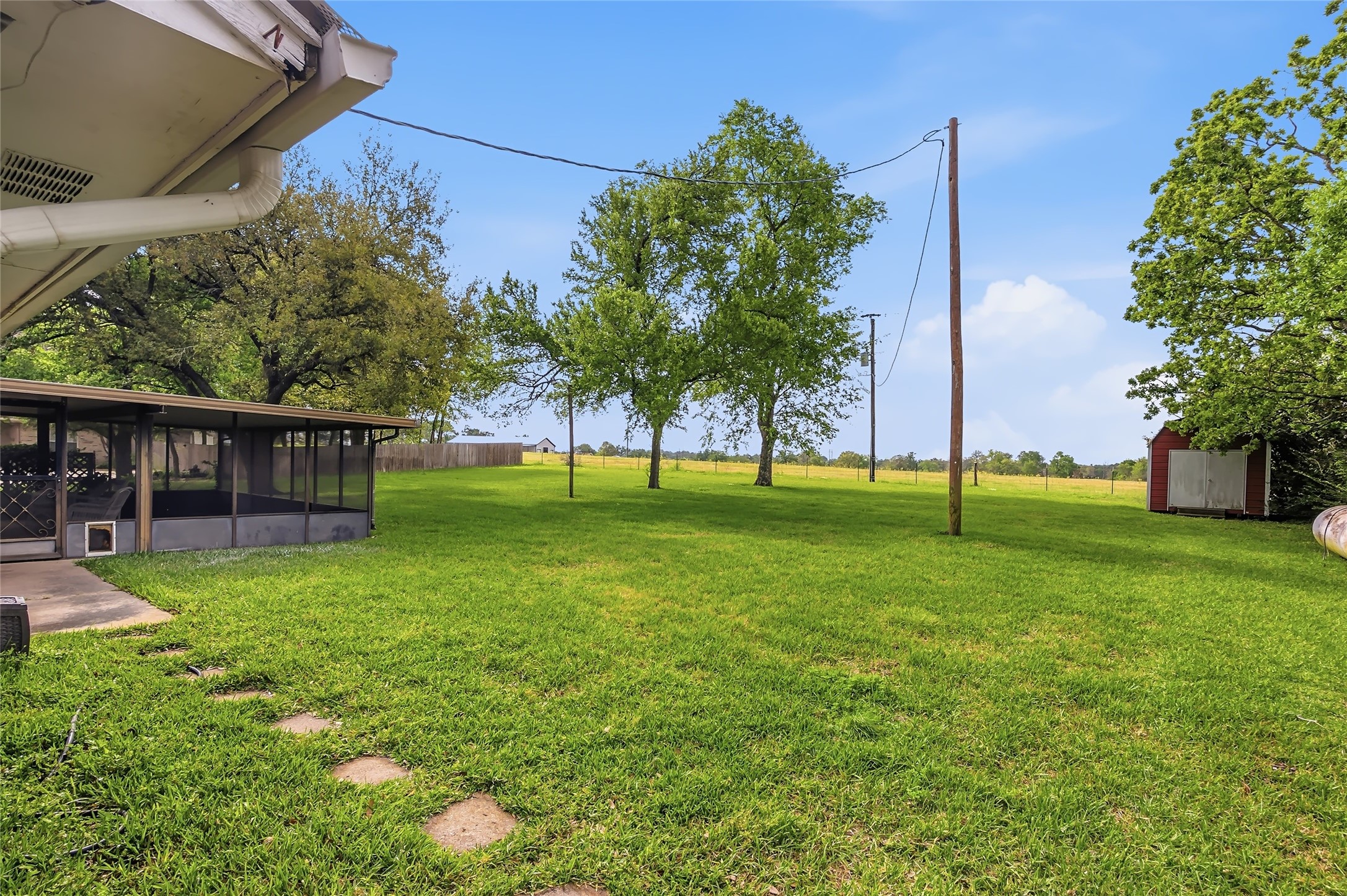807 Standley Road Madisonville, TX 77864 - Photo 33 of 35 a view of a house with a backyard