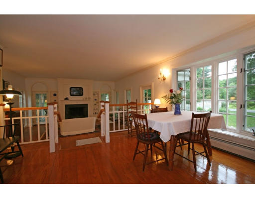 52 Porter Road Andover, MA 01810 - Photo 4 of 23 a view of a dining room with furniture and wooden floor